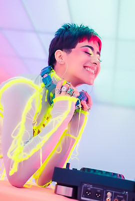 Poses Mia Valentine Flows with Music in neon lingerie