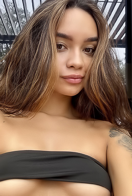 Dulces Tattoos Stand Out in Topless Black Lingerie Pose, Wicker Chair