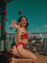 Olivia Preston and Alice Antoinette pose nude on rooftop with red roses, city view behind them - photo 00