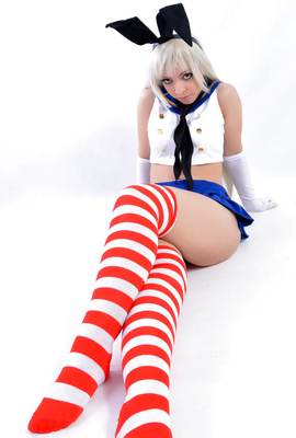 Young blonde bunny in sexy red-white socks
