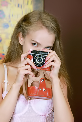 Xenia Glancing Back Over Her Shoulder With A Flirtatious Smile