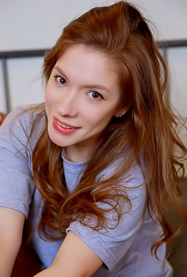 Sata Jones Voluptuous Beauty Smiles Seductively As She Spreads Her Long Legs In A Wide Split