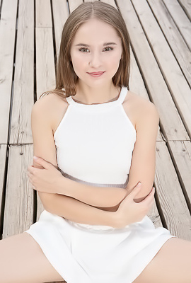 Sasha Quinn Smiling Playfully As Her Short Skirt Flips Up To Reveal She’s Not Wearing Panties