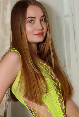 Lilia Jan Teases With A Striptease On The Couch Her Long Brunette Hair Cascading Down