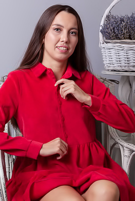 Zarusha Strips Out Of A Red Shirt Dress On A White Wicker Chair