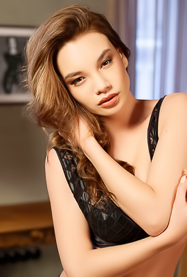 Claras Curly Hair Thrills In The Comforts On A Posh Armchair