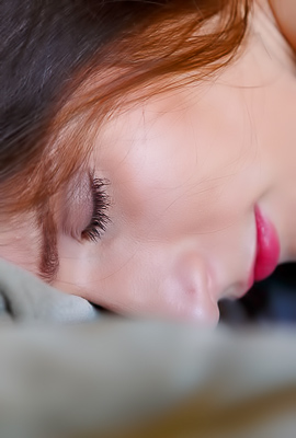 Elina Lies Back Relying Comfort On Couch With Smooth Glowing Display